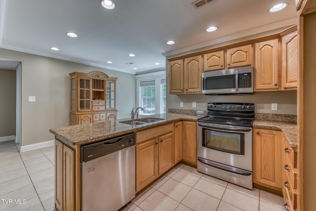 82 Hiddenbrook Ln Unit 82, Gray, TN 37615 - kitchen featuring appliances with stainless steel finishes, a peninsula, light stone countertops, light tile patterned floors, and recessed lighting