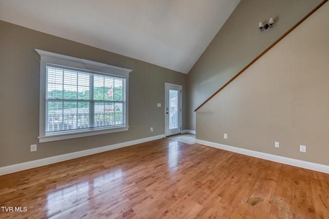 82 Hiddenbrook Ln Unit 82, Gray, TN 37615 - unfurnished living room featuring light wood-style floors and lofted ceiling