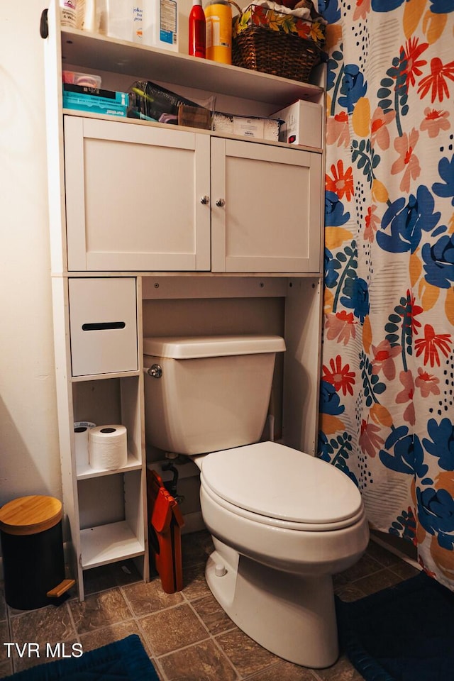 3525 James Phillips Way, Sevierville, TN 37876 - bathroom with a shower with shower curtain and stone finish flooring