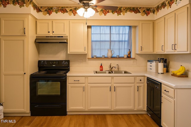 3525 James Phillips Way, Sevierville, TN 37876 - kitchen with black appliances, under cabinet range hood, light countertops, ceiling fan, and light wood finished floors