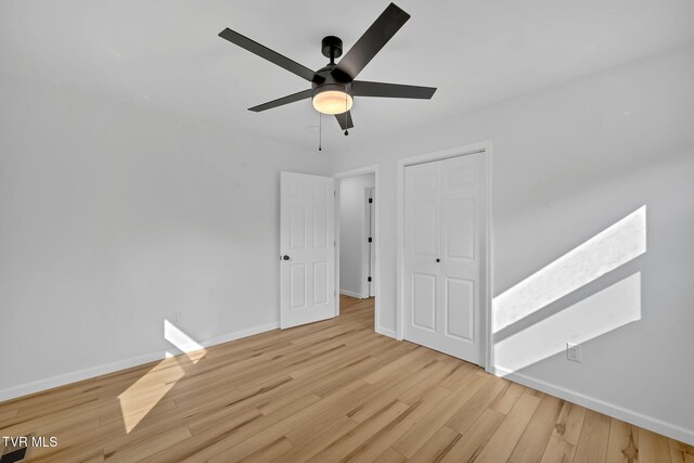 252 Kiser Cir, Jonesborough, TN 37659 - unfurnished bedroom with light wood-style floors, a closet, and ceiling fan