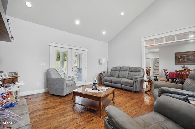 313 Treadway Trl, Jonesborough, TN 37659 - living room featuring high vaulted ceiling, french doors, stairs, wood finished floors, and recessed lighting
