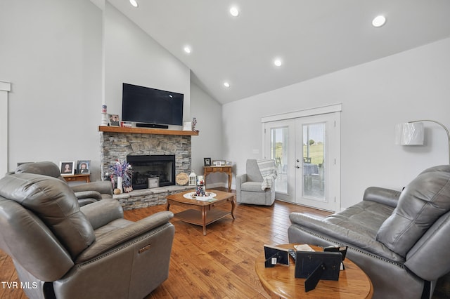 313 Treadway Trl, Jonesborough, TN 37659 - living area featuring high vaulted ceiling, light wood-style floors, recessed lighting, a stone fireplace, and french doors