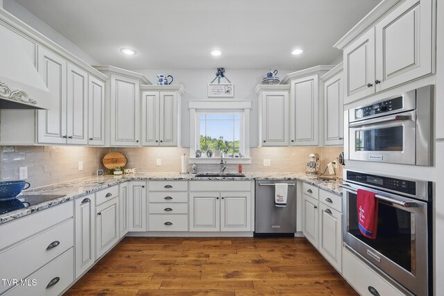 313 Treadway Trl, Jonesborough, TN 37659 - kitchen featuring stainless steel appliances, white cabinets, premium range hood, tasteful backsplash, and dark wood-style floors