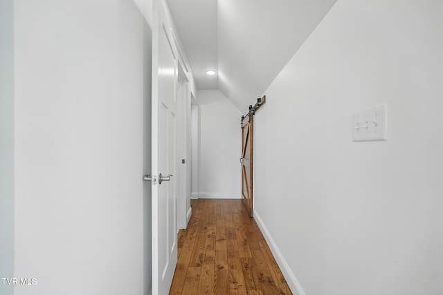 313 Treadway Trl, Jonesborough, TN 37659 - hall featuring a barn door, recessed lighting, wood finished floors, and vaulted ceiling