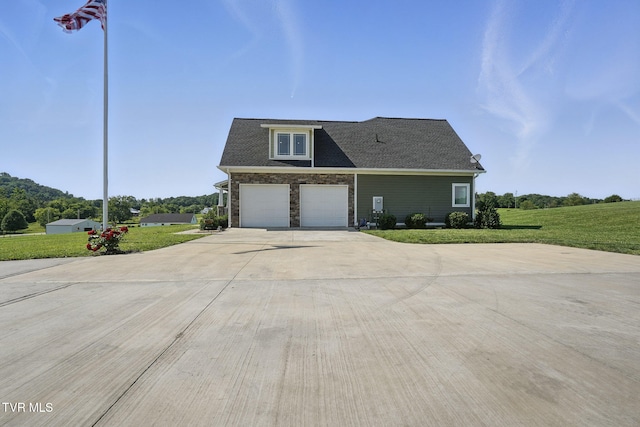313 Treadway Trl, Jonesborough, TN 37659 - view of front of house featuring concrete driveway, a front lawn, a garage, and stone siding