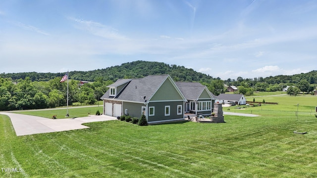 313 Treadway Trl, Jonesborough, TN 37659 - view of home's exterior featuring driveway, a lawn, a wooded view, and an attached garage