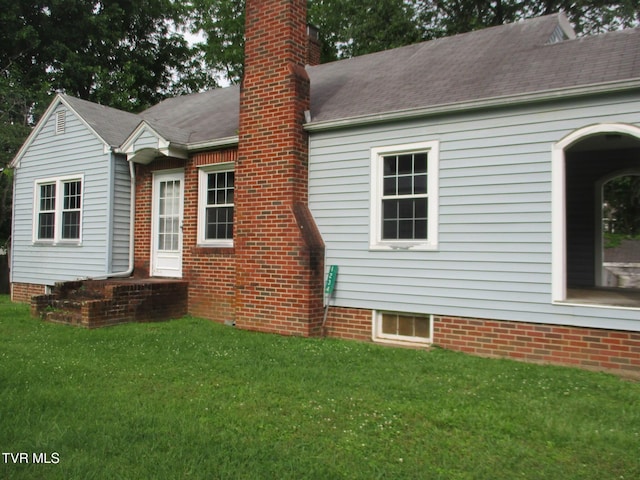 1234 Bristol Hwy, Elizabethton, TN 37643 - back of house featuring a yard and a chimney