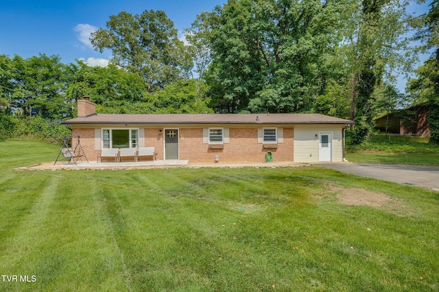 309 Knob Hill Dr, Bristol, TN 37620 - ranch-style house featuring a chimney, brick siding, and a front lawn