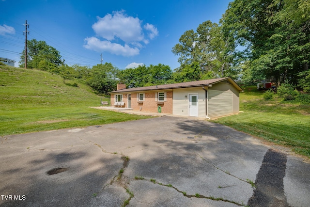309 Knob Hill Dr, Bristol, TN 37620 - ranch-style house with a chimney, a front yard, and driveway