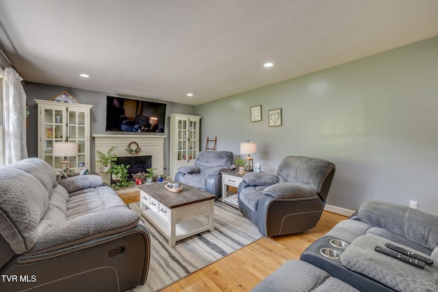 309 Knob Hill Dr, Bristol, TN 37620 - living area with light wood finished floors, a brick fireplace, and recessed lighting