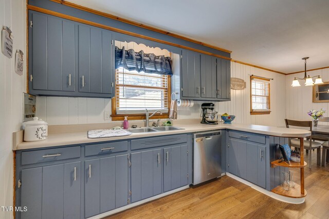 309 Knob Hill Dr, Bristol, TN 37620 - kitchen with stainless steel dishwasher, ornamental molding, light wood-style flooring, a peninsula, and light countertops