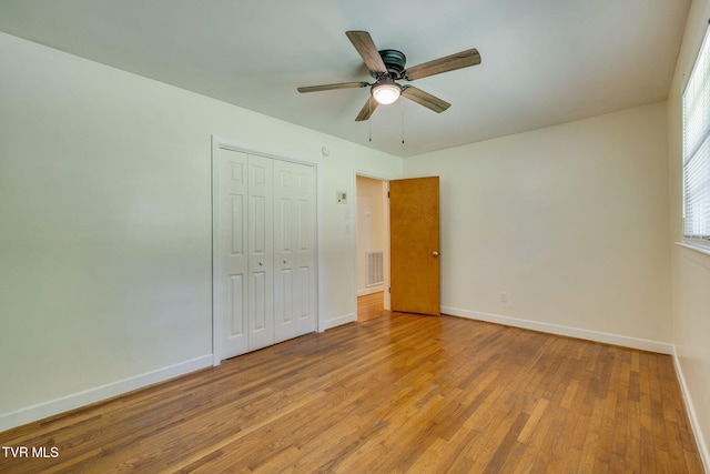 309 Knob Hill Dr, Bristol, TN 37620 - unfurnished bedroom with light wood-style floors, a closet, and a ceiling fan