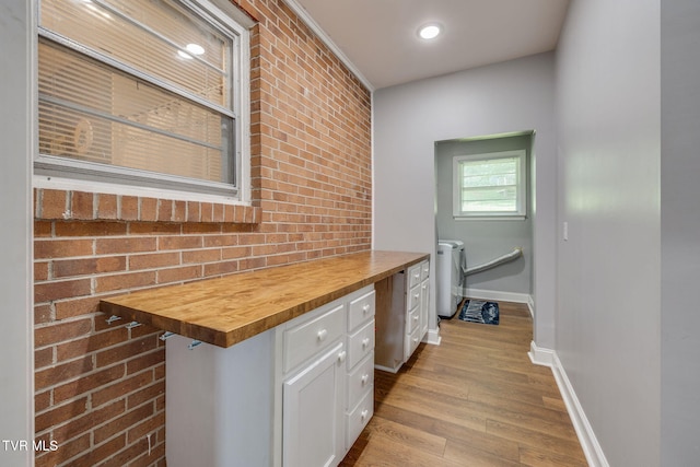 309 Knob Hill Dr, Bristol, TN 37620 - corridor with wood finished floors, brick wall, a desk, and recessed lighting