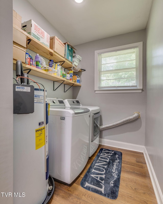 309 Knob Hill Dr, Bristol, TN 37620 - laundry room with water heater, washer and clothes dryer, and wood finished floors