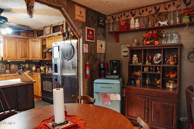 3504 James Phillips Way, Sevierville, TN 37876 - kitchen with stainless steel refrigerator with ice dispenser, electric range, ceiling fan, a textured ceiling, and range hood