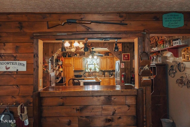 3504 James Phillips Way, Sevierville, TN 37876 - bedroom with freestanding refrigerator and wooden walls