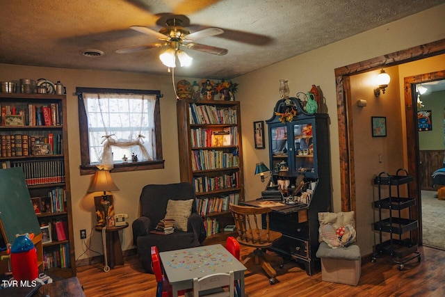 3504 James Phillips Way, Sevierville, TN 37876 - living area with wood finished floors, ceiling fan, and a textured ceiling