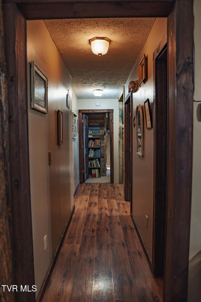 3504 James Phillips Way, Sevierville, TN 37876 - corridor with dark wood-type flooring and a textured ceiling