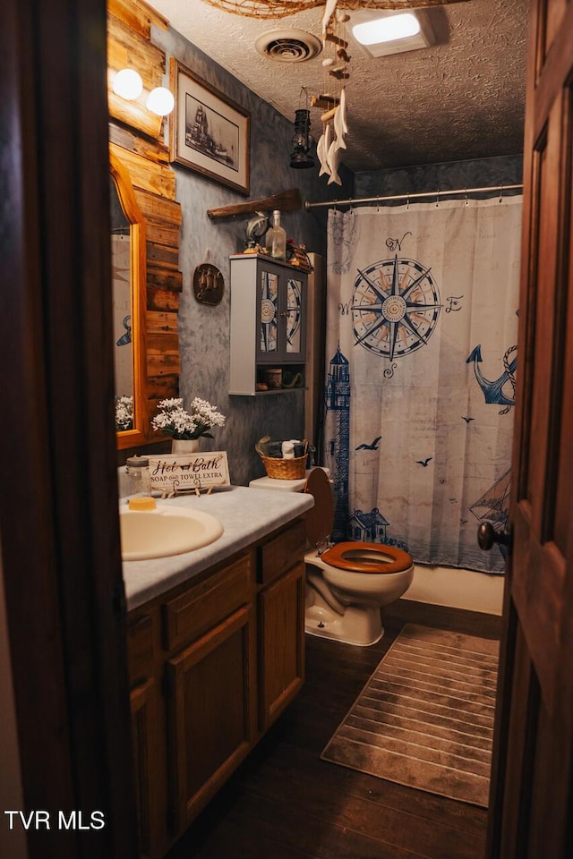 3504 James Phillips Way, Sevierville, TN 37876 - full bath with vanity, wood finished floors, curtained shower, and a textured ceiling