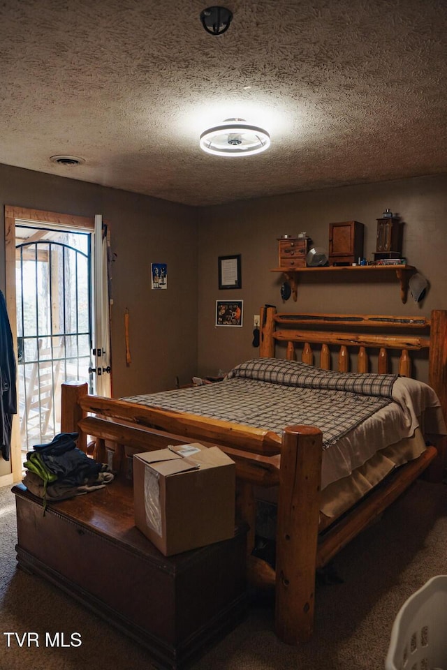 3504 James Phillips Way, Sevierville, TN 37876 - carpeted bedroom featuring a textured ceiling