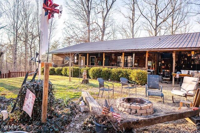 3504 James Phillips Way, Sevierville, TN 37876 - rear view of house featuring an outdoor fire pit and a metal roof