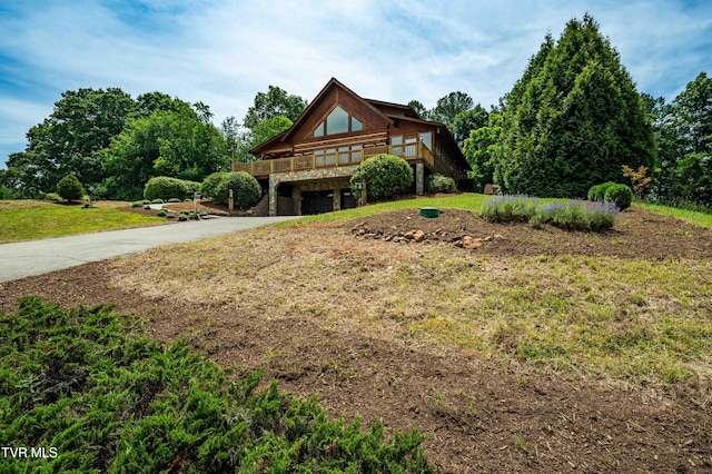 289 Harbor View Rd, Butler, TN 37640 - view of front of property with driveway, an attached garage, a front yard, and a wooden deck