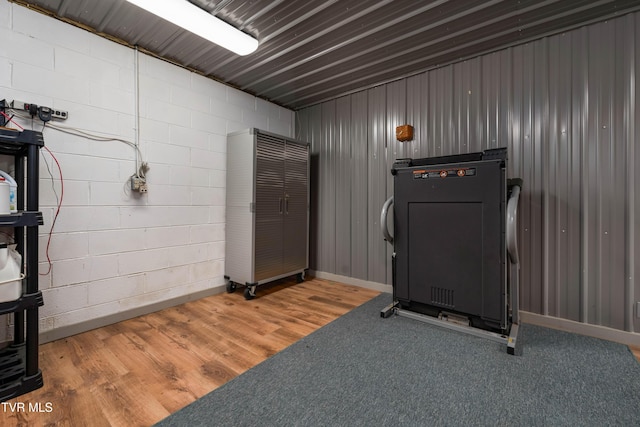 289 Harbor View Rd, Butler, TN 37640 - workout area with concrete block wall and light wood finished floors