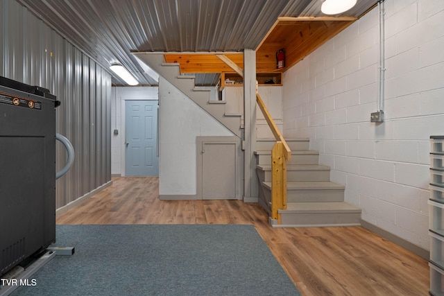 289 Harbor View Rd, Butler, TN 37640 - finished basement with stairs, wood finished floors, and concrete block wall