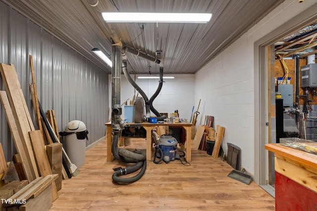 289 Harbor View Rd, Butler, TN 37640 - miscellaneous room featuring wood finished floors, concrete block wall, and electric panel