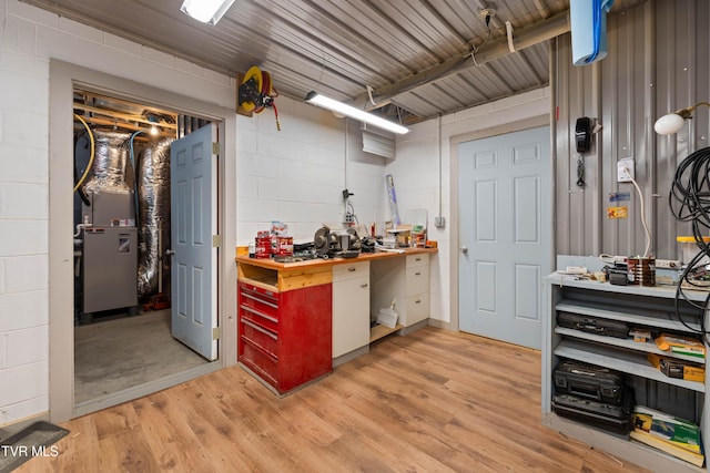 289 Harbor View Rd, Butler, TN 37640 - kitchen with light wood-style floors, concrete block wall, and wooden counters