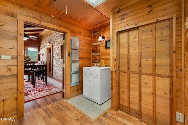 289 Harbor View Rd, Butler, TN 37640 - laundry room featuring wooden ceiling, wood walls, light wood finished floors, and ceiling fan