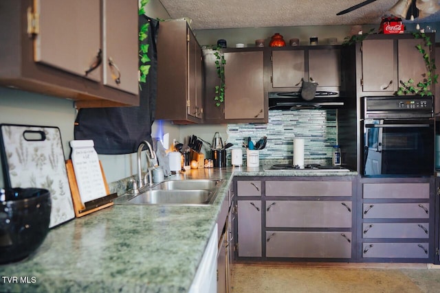 3516 James Phillips Way, Sevierville, TN 37876 - kitchen featuring black oven, cooktop, under cabinet range hood, backsplash, and light countertops