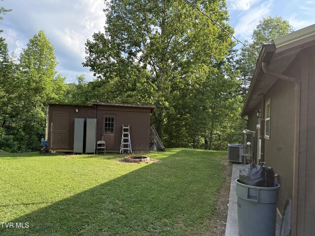 3516 James Phillips Way, Sevierville, TN 37876 - view of grassy yard with a shed and an outdoor fire pit