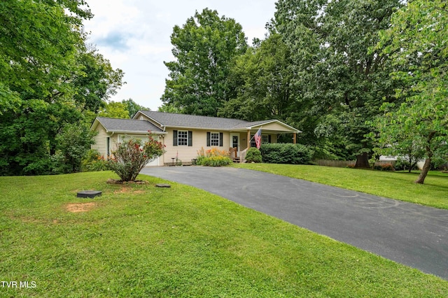 149 Cochran Rd, Jonesborough, TN 37659 - single story home featuring asphalt driveway, a front yard, a garage, and a porch
