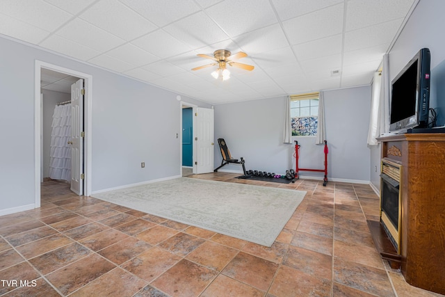 149 Cochran Rd, Jonesborough, TN 37659 - workout area featuring ceiling fan, a paneled ceiling, a fireplace, and stone finish floors