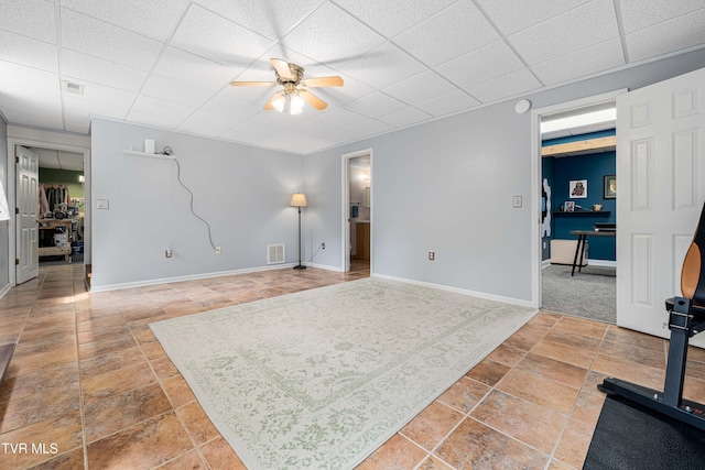 149 Cochran Rd, Jonesborough, TN 37659 - unfurnished living room with ceiling fan, a paneled ceiling, and stone tile flooring