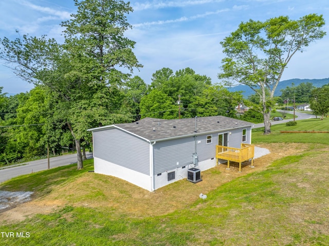 1826 Loop Rd, Lafollette, TN 37766 - rear view of property with roof with shingles, a deck with mountain view, and a lawn