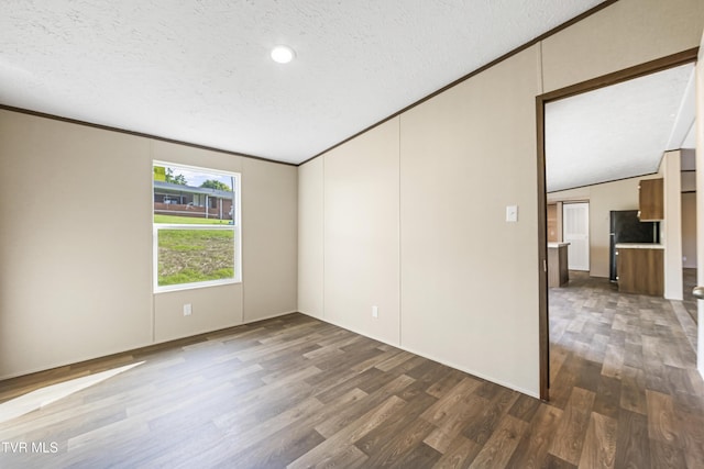 1826 Loop Rd, Lafollette, TN 37766 - unfurnished room featuring wood finished floors, a textured ceiling, ornamental molding, and lofted ceiling