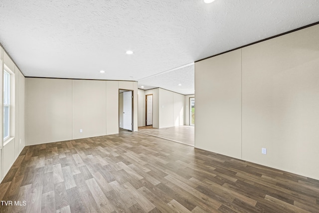 1826 Loop Rd, Lafollette, TN 37766 - empty room featuring wood finished floors, recessed lighting, and a textured ceiling