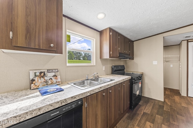 1826 Loop Rd, Lafollette, TN 37766 - kitchen featuring black appliances, under cabinet range hood, dark wood-type flooring, light countertops, and a textured ceiling