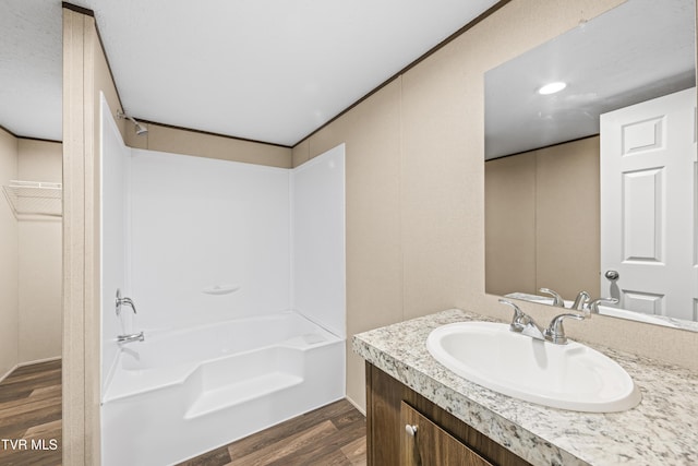 1826 Loop Rd, Lafollette, TN 37766 - bathroom with wood finished floors, vanity, and bathing tub / shower combination