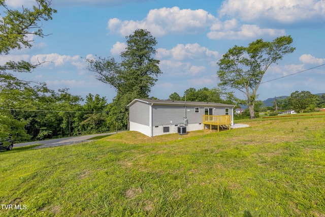 1826 Loop Rd, Lafollette, TN 37766 - rear view of property with a yard and a deck