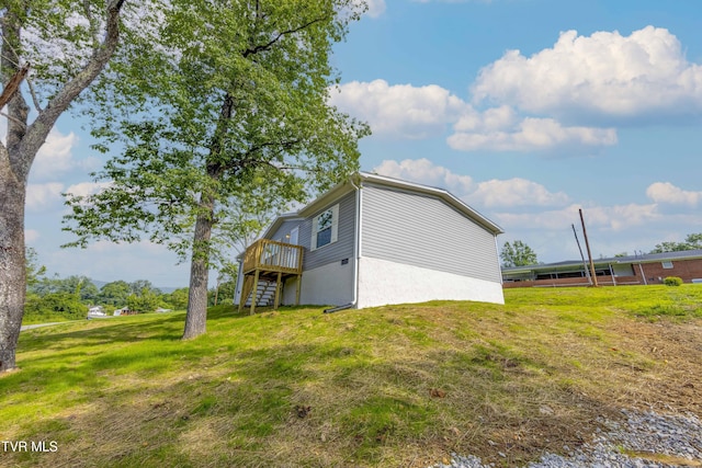 1826 Loop Rd, Lafollette, TN 37766 - view of property exterior featuring a deck, stairs, and a yard