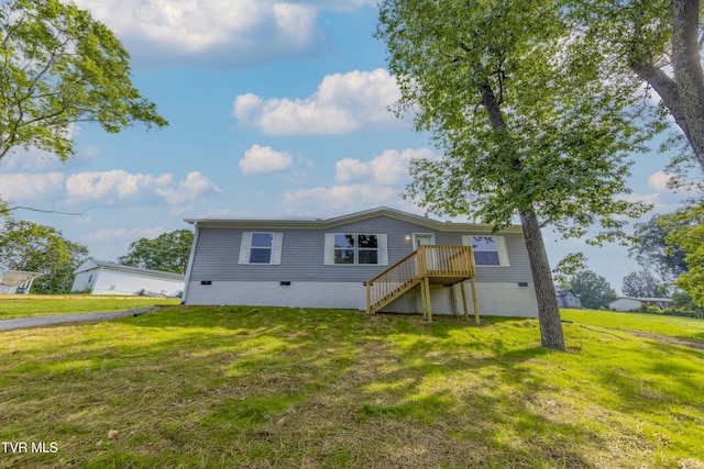 1826 Loop Rd, Lafollette, TN 37766 - back of house featuring a lawn and stairway