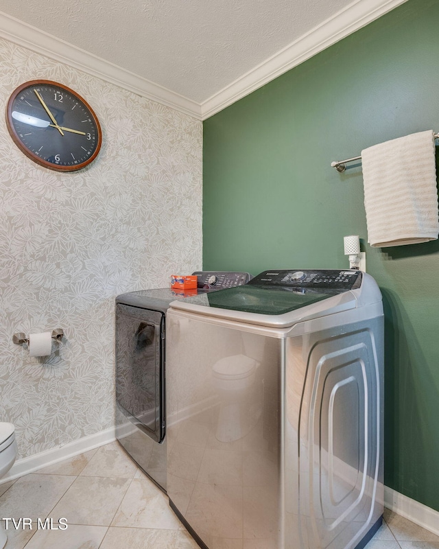 1933 Sand St, Kingsport, TN 37660 - laundry room featuring washing machine and clothes dryer, ornamental molding, wallpapered walls, and a textured ceiling