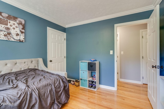 1933 Sand St, Kingsport, TN 37660 - bedroom with wood finished floors, crown molding, and a textured ceiling