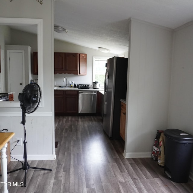 206 Hialeah Dr, Kingsport, TN 37660 - kitchen featuring appliances with stainless steel finishes, dark wood-type flooring, light countertops, and brown cabinets