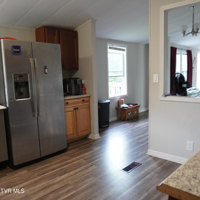 206 Hialeah Dr, Kingsport, TN 37660 - kitchen featuring stainless steel fridge, dark wood finished floors, brown cabinetry, and a chandelier