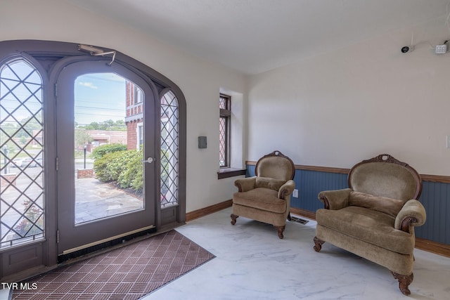 701 W Locust St Unit 34, Johnson City, TN 37604 - entrance foyer featuring marble finish flooring and a wainscoted wall